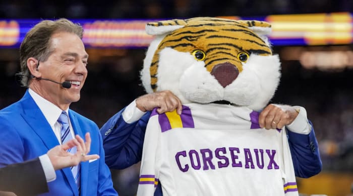 Nick Saban appears on ESPN’s ‘College GameDay’ next to Lee Corso, who is wearing LSU mascot Mike the Tiger’s head.